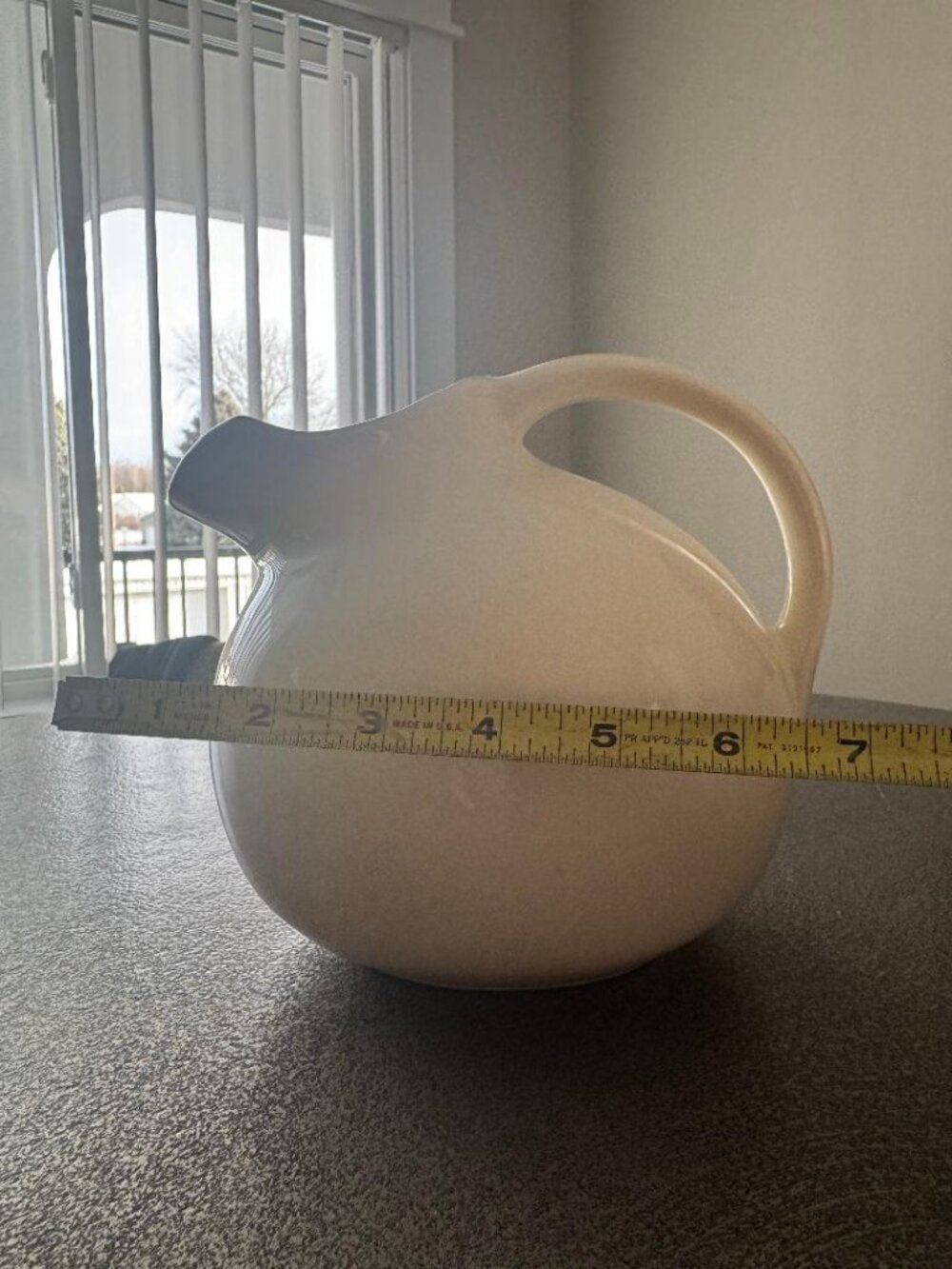 Ceramic tilted ball pitcher
